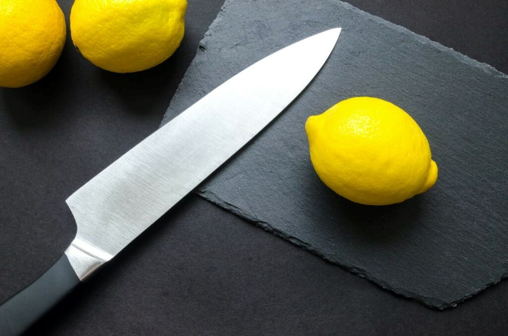 Knife and Lemon Placed Near