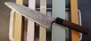 Knife placed on sharpening stones