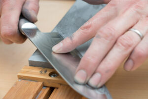 chef honing the knife before use